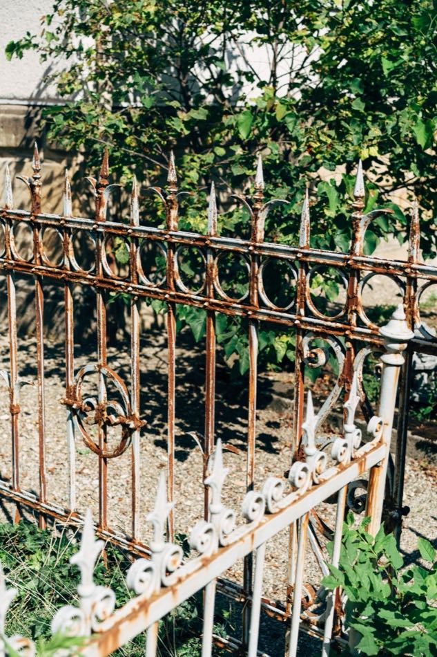 A decorative wrought iron fence with an ornate pattern