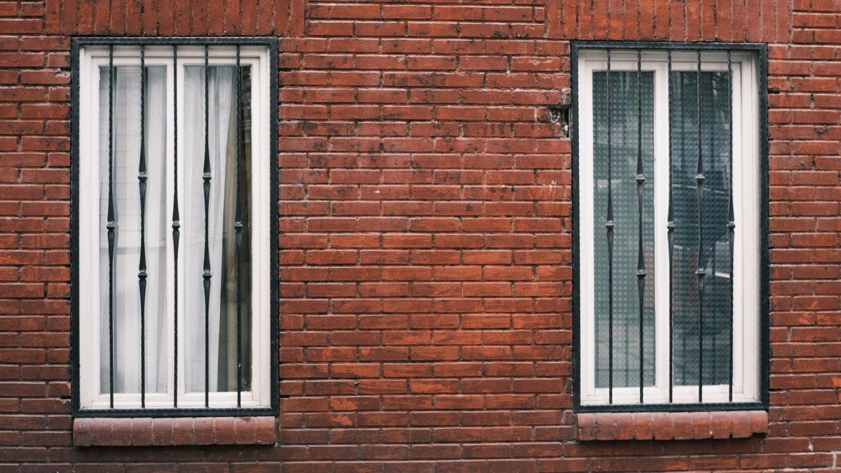 A barred window on a brick building